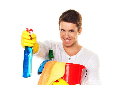 Satisfied homeowner enjoying a clean patio by Mike's Cleaners